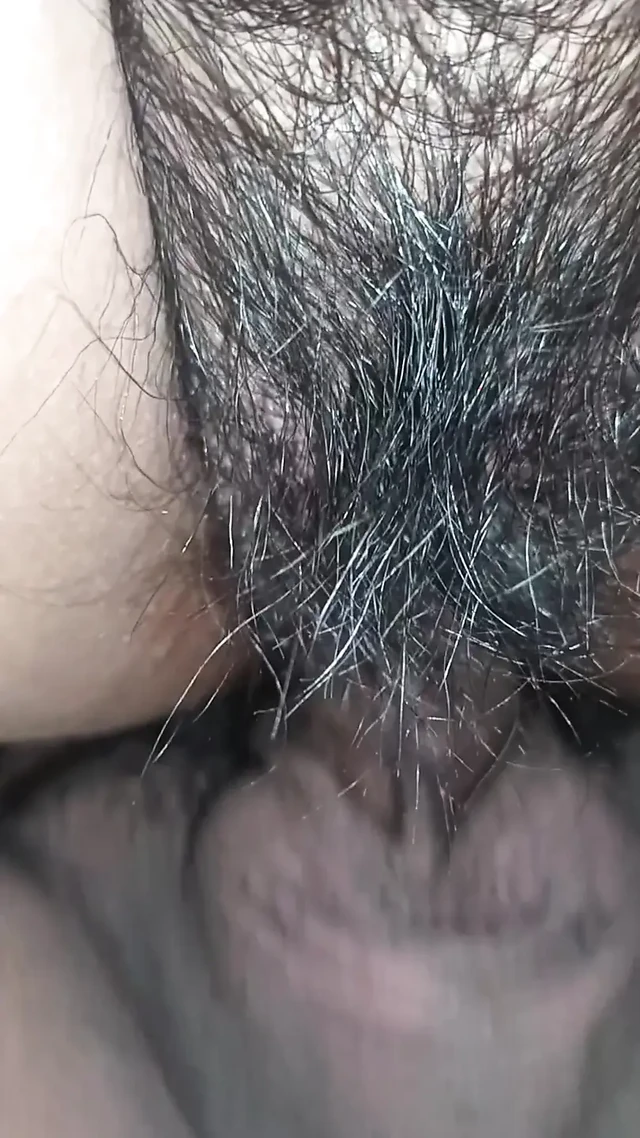 Close up view on a hairy and creamy pussy