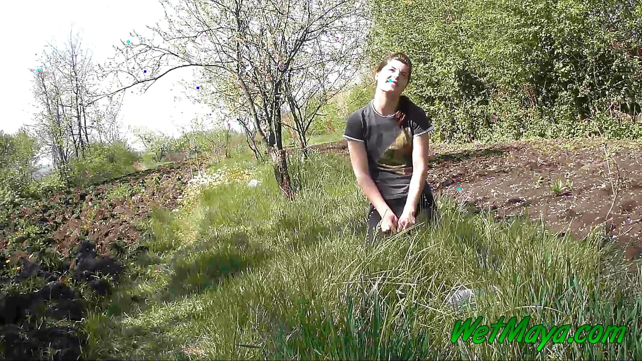 Pissing in grass on the side of the road