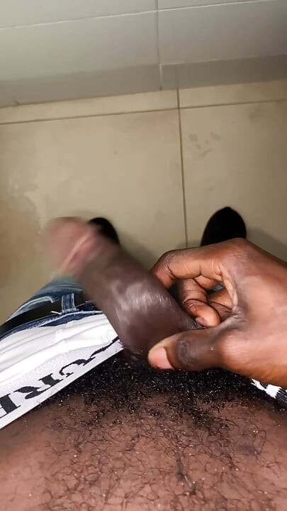 Thug beating his meat in the office