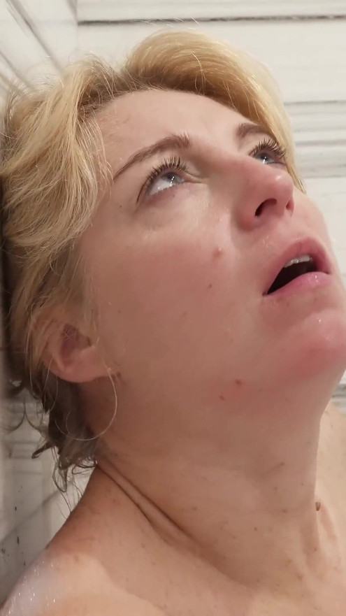 Soapy stepmom fingering her holes