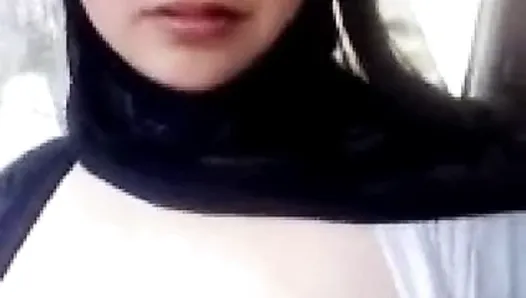 Muslim girl with hijab veil shows off her big boobs