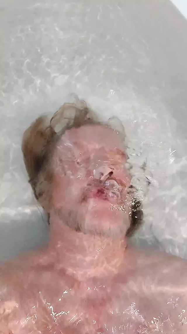 Another bath in a yellow thong