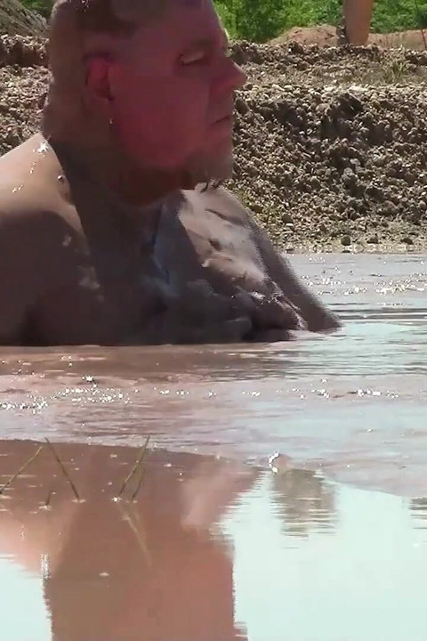 Deep, Creamy Brown Mud Bath in a Sand Pit