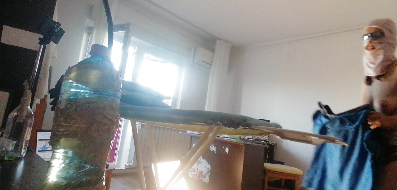 Amateur wife doing housework naked. Sexy and naughty wife trying on clothes that she cuts.