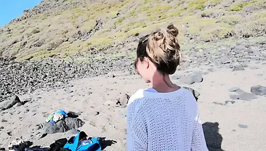 A strange blonde girl gives me a blowjob on the beach