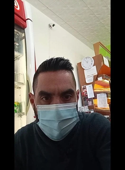 Shopkeeper showing a little