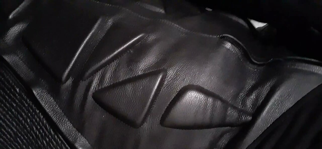 Biker cums in leather moto race suit