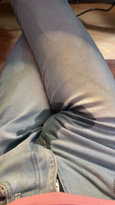 Chasity caged and peeing already pee stained jeans while gaming
