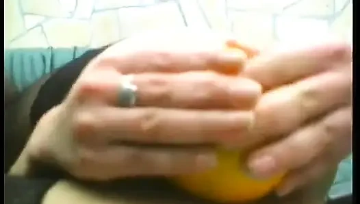 Brunette mature slut wearing stockings while drilling her holes with food and huge candle