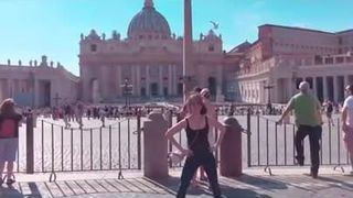 Alison Brie dancing in front of the Vatican