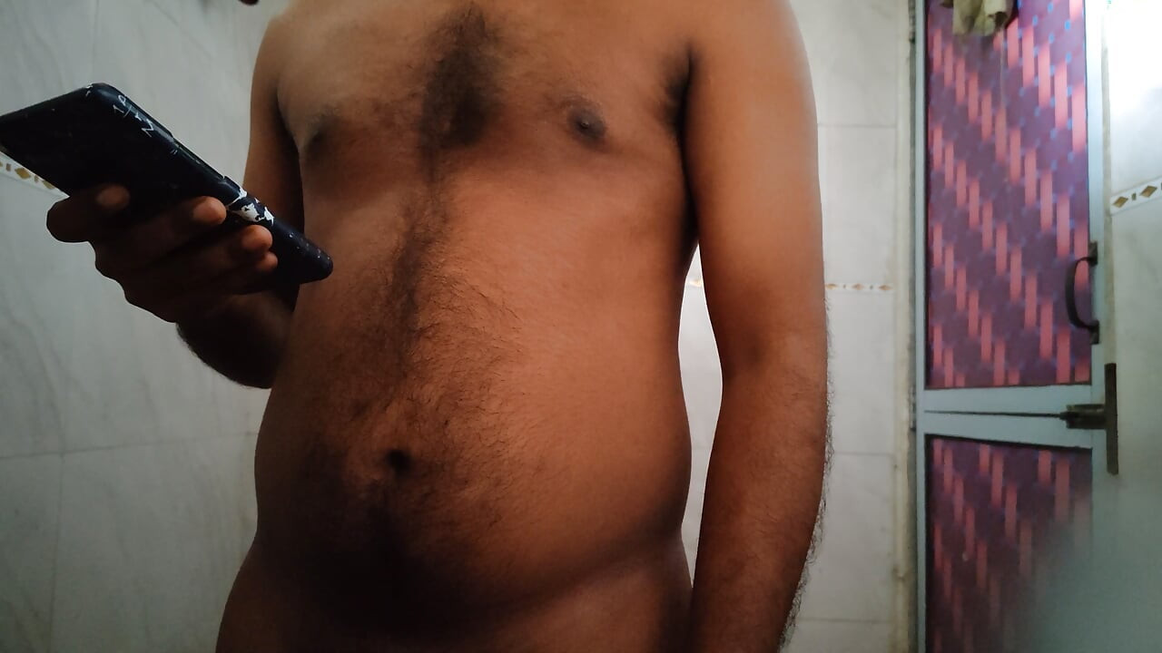 Stroking my cock hard in bathroom