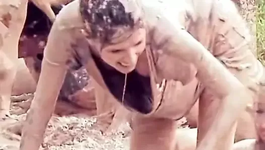Anna Kendrick showing cleavage as she crawls in mud