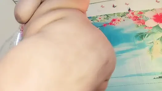 Sexy chubby girl dances for her neighbor and strips naked in front of the window