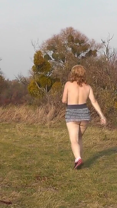 Powerful moment from "Naked in public. Outdoors sexy woman Milf without panties and bra playing sports Outside. Natural"