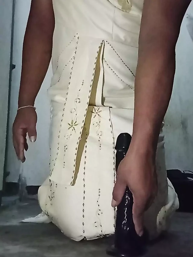 Crossdresser in Thai dress with her beloved dildo