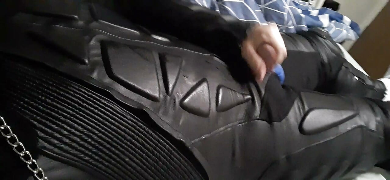 Biker cums in leather moto race suit