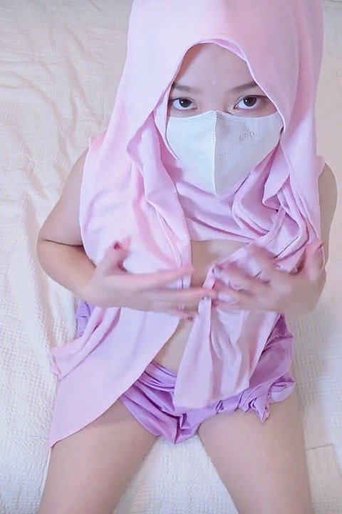 A Naughty Malaysian Hijabi with Boobies Teasing in Purple Dress Without Bra