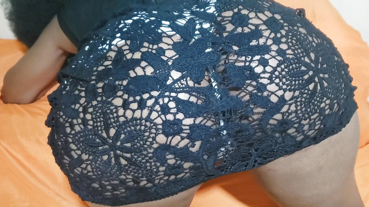 A Woman in a Black Dress at the Hotel with Her Panties Teasing Her Butt