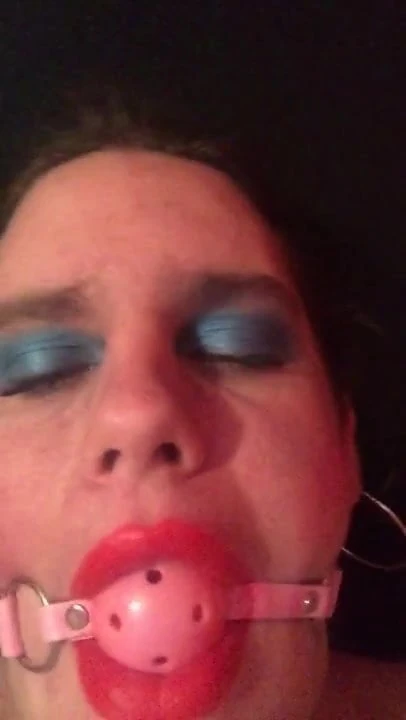 Sissy getting a gag put on