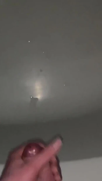 Captivating moment from "Young guy cums hard after rough cock jerking in bathroom"
