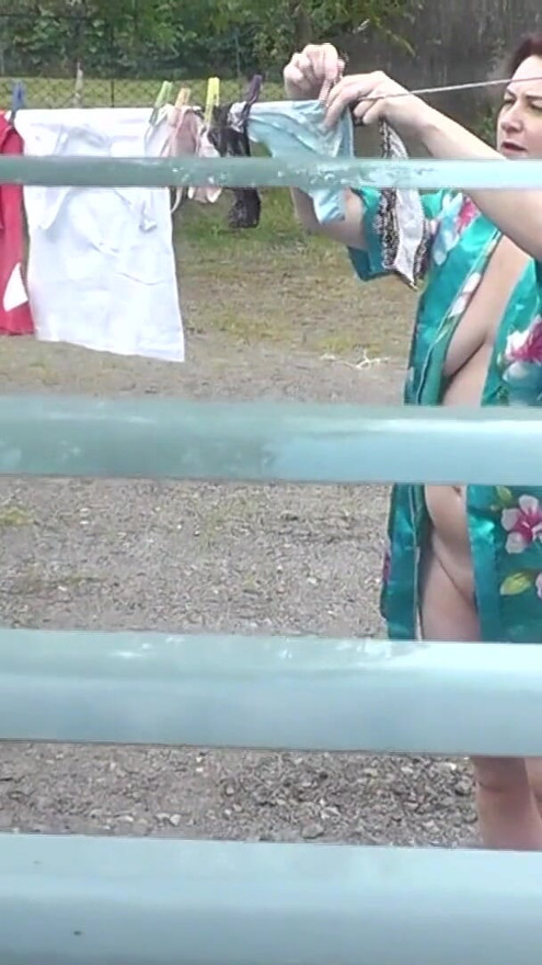 Naked in public. Neighbor saw pregnant neighbor in window who was drying clothes in yard without bra and panties. Nudist | Clip 1