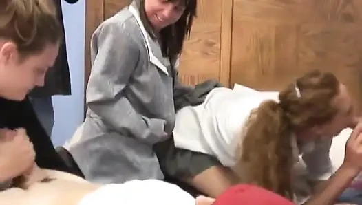 Mature Brunette Sucks Young Guy as Two Cute Coeds Share Old Penis on a Bed