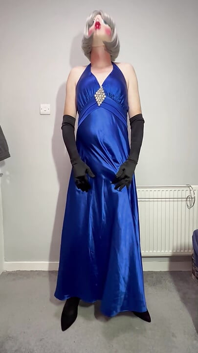 Sissy crossdresser playing in a satin ball gown