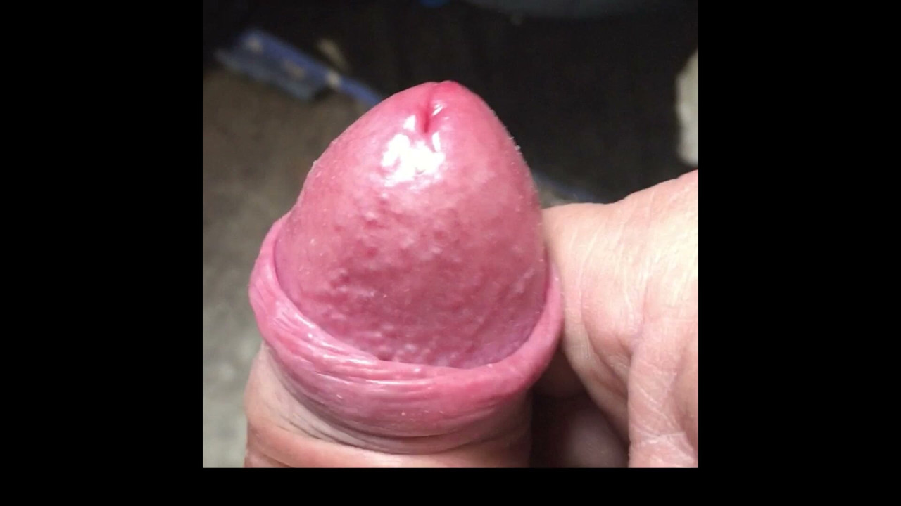 close up of uncut cock spunking