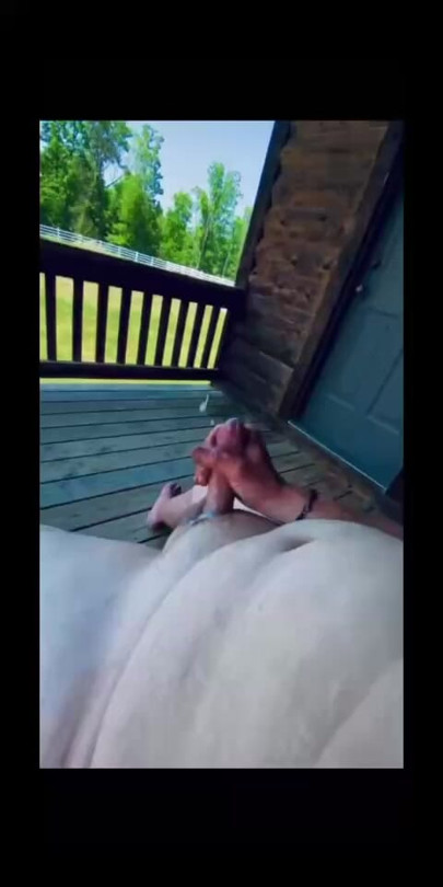 Chubby guy on his dads back porch blowing a big load of cum