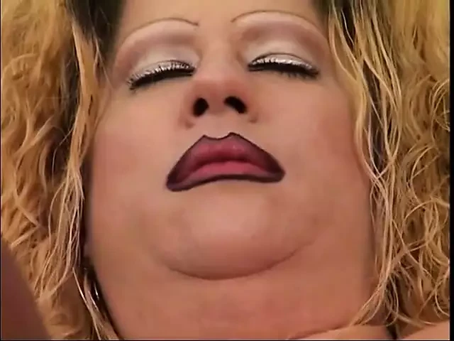 Blonde bends over her fat friend and fucks her from behind with vibrator
