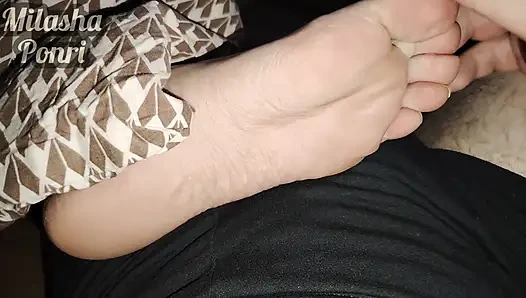 Stepsister's feet get a light massage while watching a movie