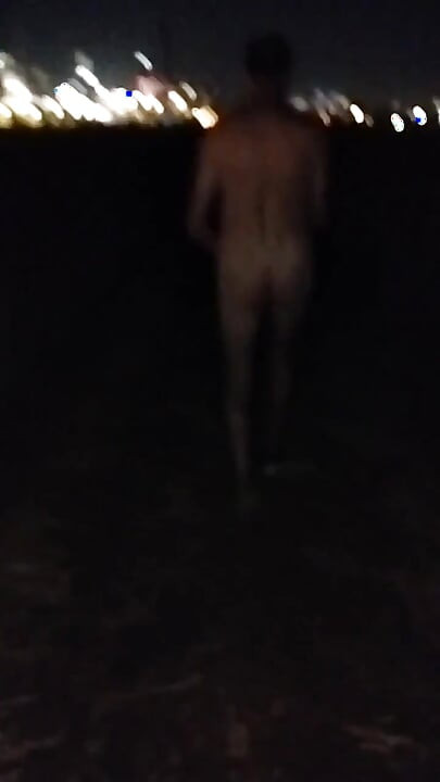 Naked Walking on the Hill Along Highway
