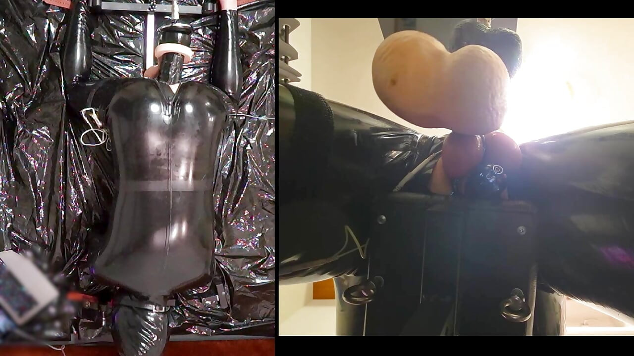Session in the pillory with Latex Catsuit, PA Chastity, Giant Didildo and Estim