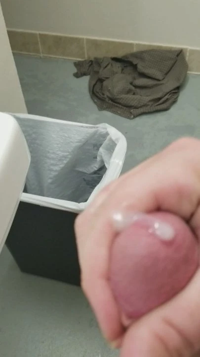 Stroking cock in a public shower room