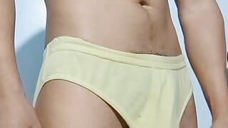 Horny gymnast stroking his huge throbbing cock in underwear