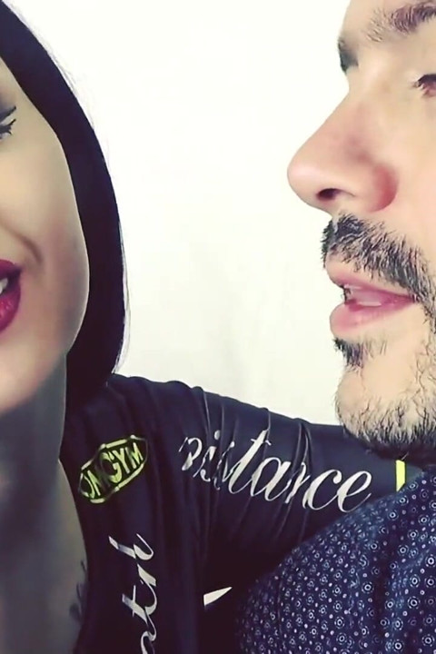 Covering Alex with red shiny lipstick kisses all over his face!
