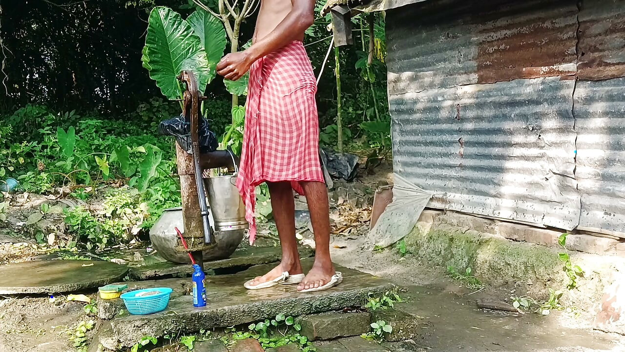 Desi young man bath Open place.