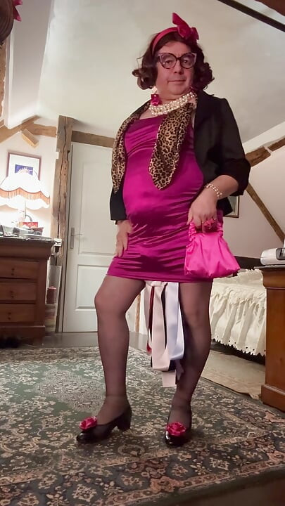 Dressed in a short fuchsia dress for an evening out