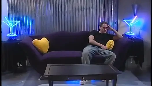 Blonde in leather deep throats white cock then gets fucked on sofa