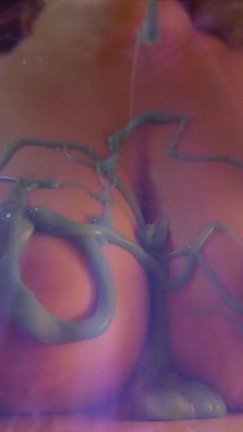 Key moment from "Worldest Most Beautiful Tits Ever 🍒 Young Artist Covers her Amazing Breasts with Slime - Slowmotion"