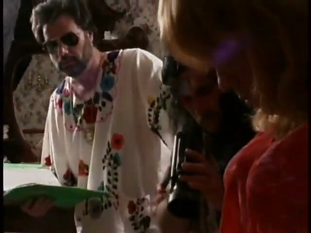 Ron Jeremy organizes orgy with a 70s crossdresser face fucking busty brunette on bed