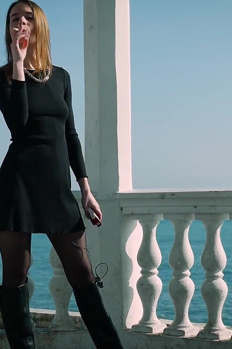 Young Russian Girl Smoking Cigarette by Seaside