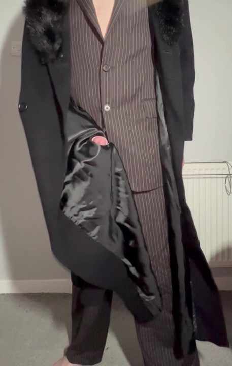 Sissy playing with cock in a ladies long coat and suit stroking myself with the lining of my coat