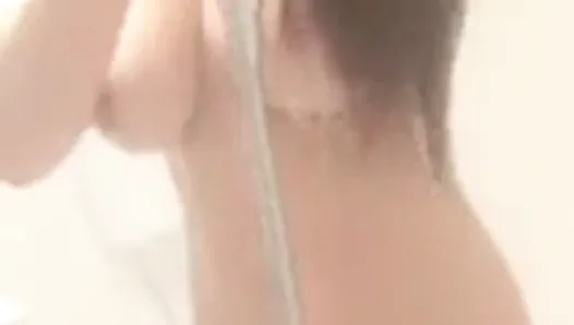 Beautiful busty chinese girl taking a shower