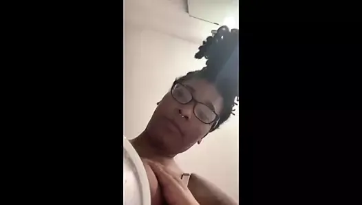 Busty black Youtuber fills cup with chocolate milk