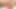 Redhead ladyboy in green dress pumps her trimmed cock in bed
