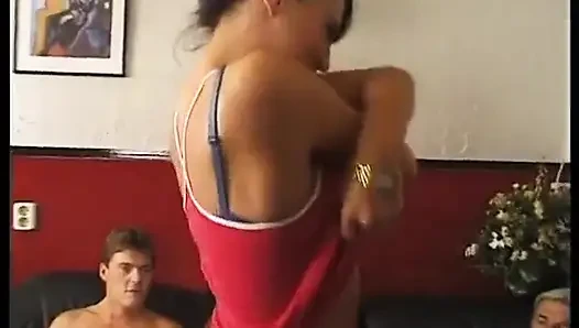 Naked brunette surrounded by three horny men fucking her ass hole like a...