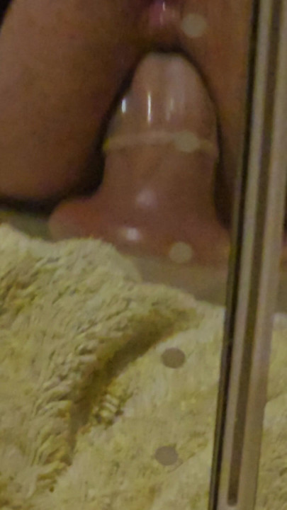 Huge toy in my ass. Watching myself in the mirror.