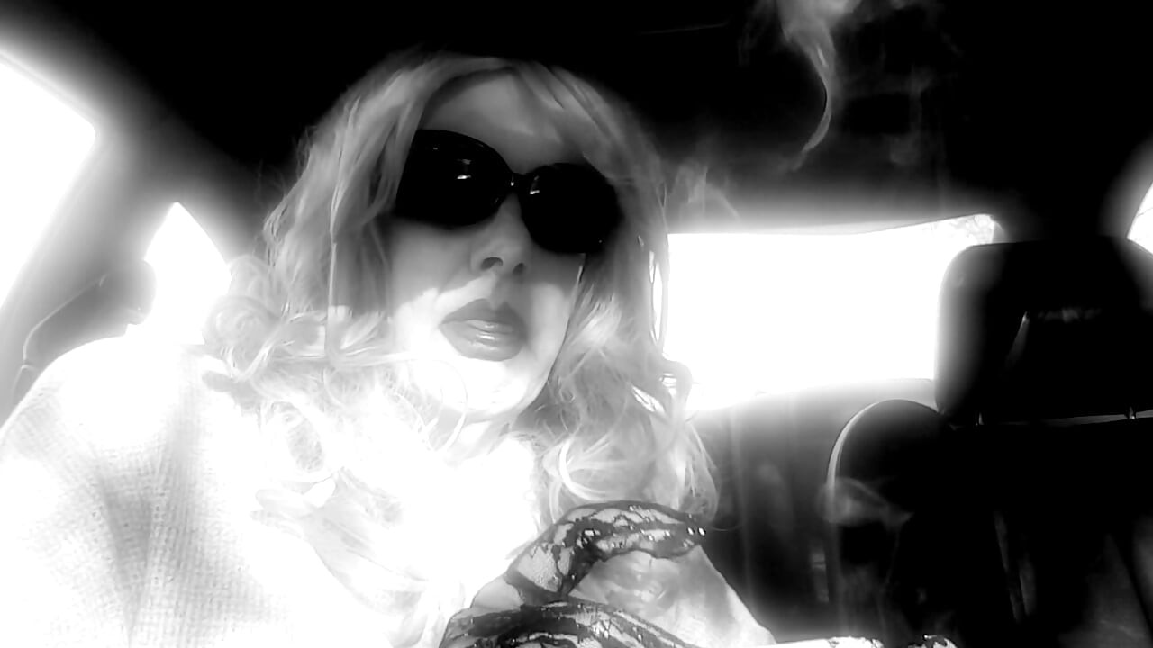 MRS. ROMAN SMOKING MARLBORO 100's IN HER CAR