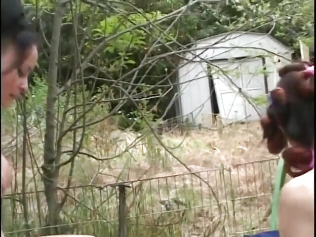 Mature woman gets a younger woman naked outside and fingers her cunt